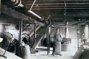 Miller with sacks at South Mill Miller with sacks at South Mill