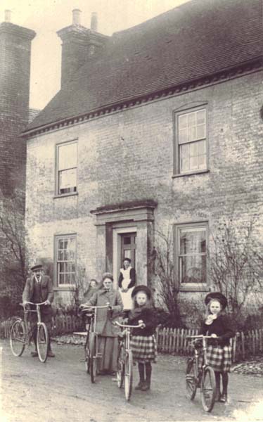 Midwife Kate Micklam with her family photographed in the early 1900s oustide Barnards