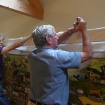 The panel is transferred to the oak frame